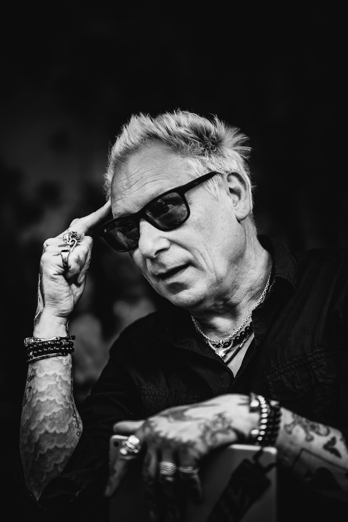 character studio portrait in palma, older man with sunglasses, candid gesture, monochrome